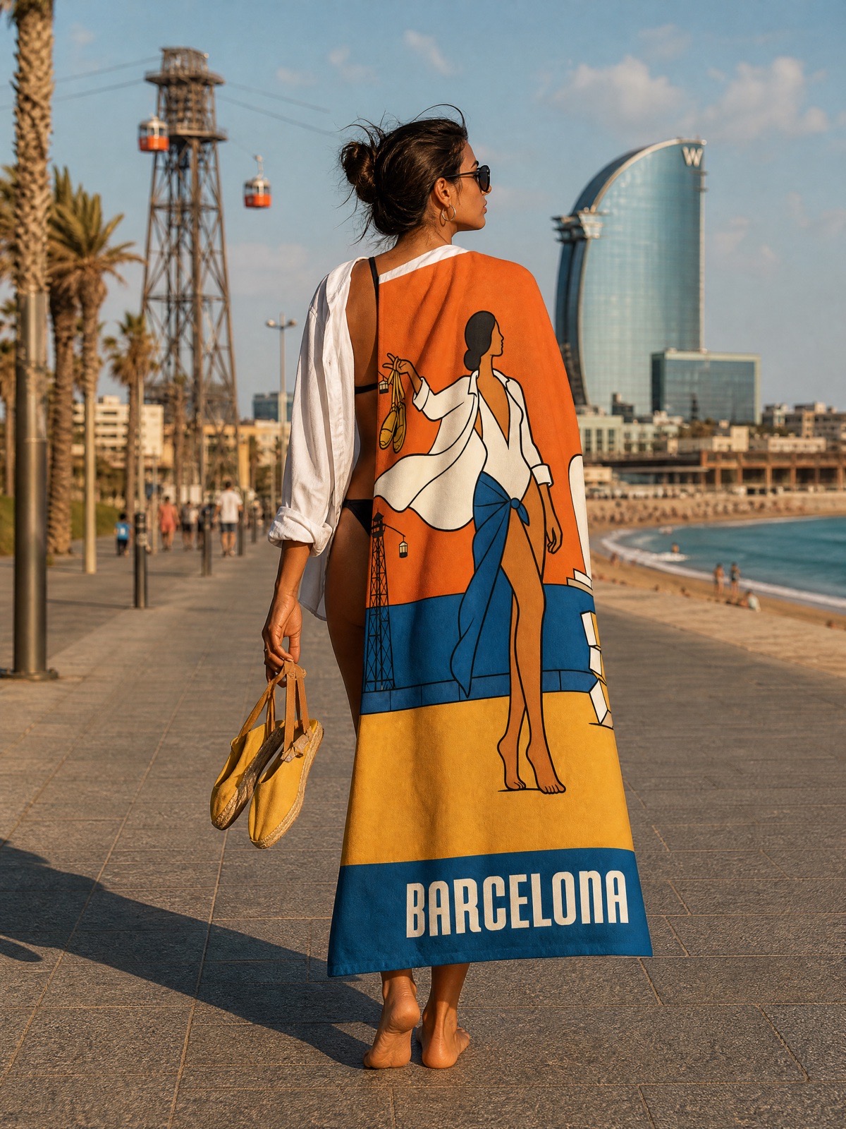 The BARCELONA beach towel on the boardwalk at Barceloneta